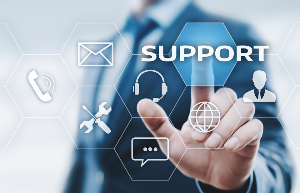 Person pressing a button saying "support"